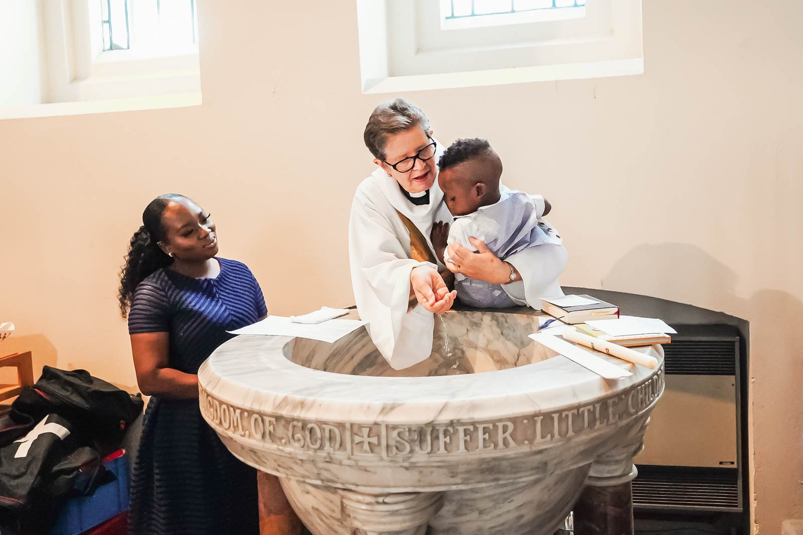 christening of child in church baptism photographer London